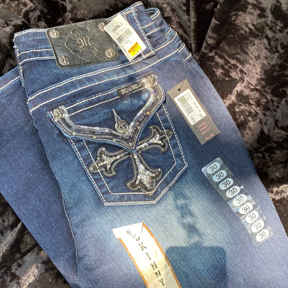 With tags.  Miss Me skinny jeans. Mid-rise, Skinny size 30.